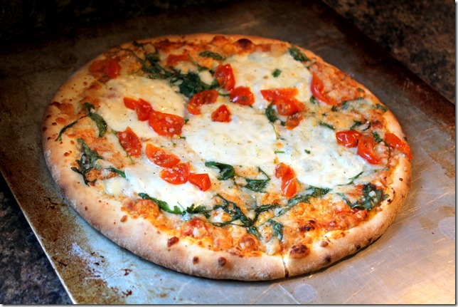 Mediterranean Arugula & Tomato wood fired pizza